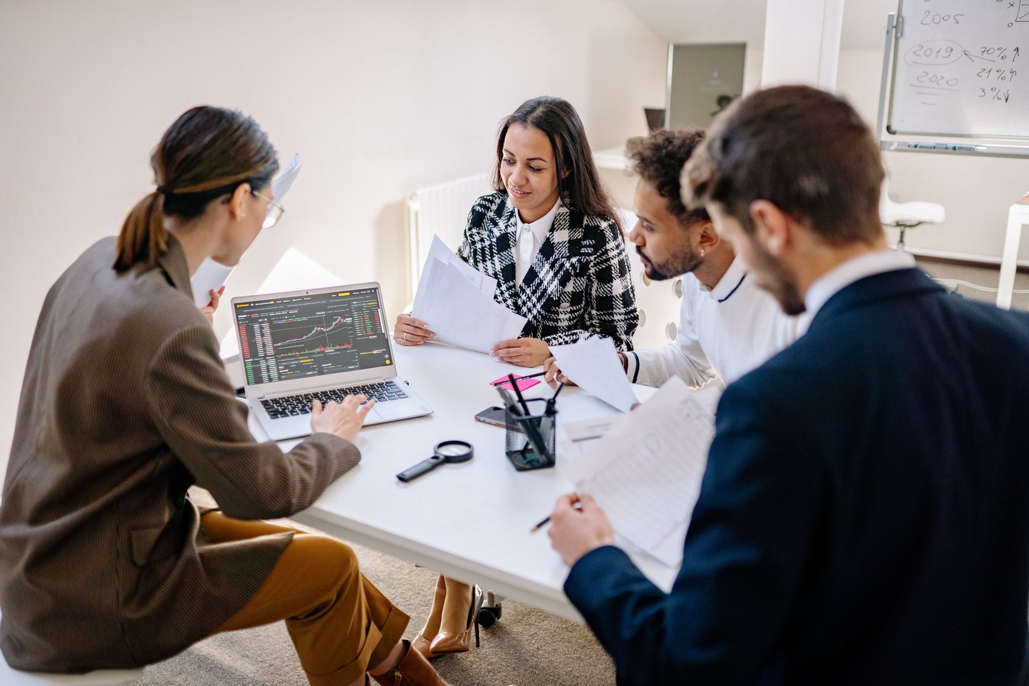 Business professionals reviewing performance information during a planning meeting